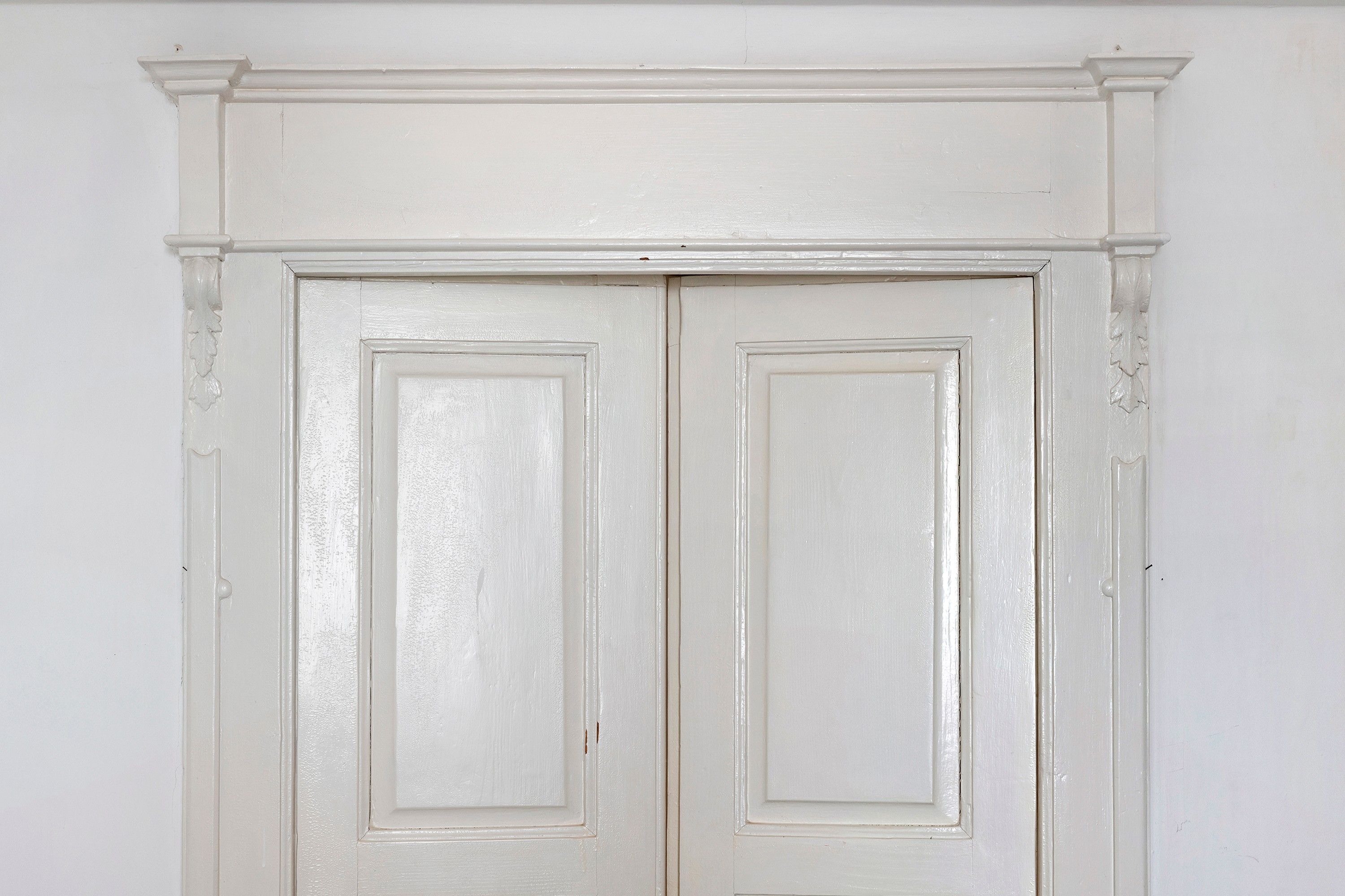 A white double door with a simple design and no visible handles.