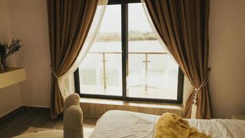 Economy Apartment, Balcony, City View | In-room safe, desk, laptop workspace, blackout drapes
