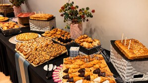 A buffet table with various baked goods and pastries. - Numa Valencia Sant Agustí (València)