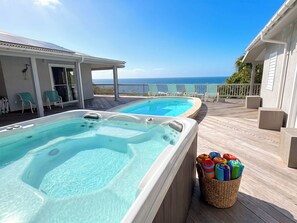 Two hot tubs on a wooden deck with a view of the ocean. - Brizan Villa – Private 3 Bedroom Caribbean Retreat with Pool, Hot Tub & Stunning Reef Bay Views in St. John, USVI (St John)
