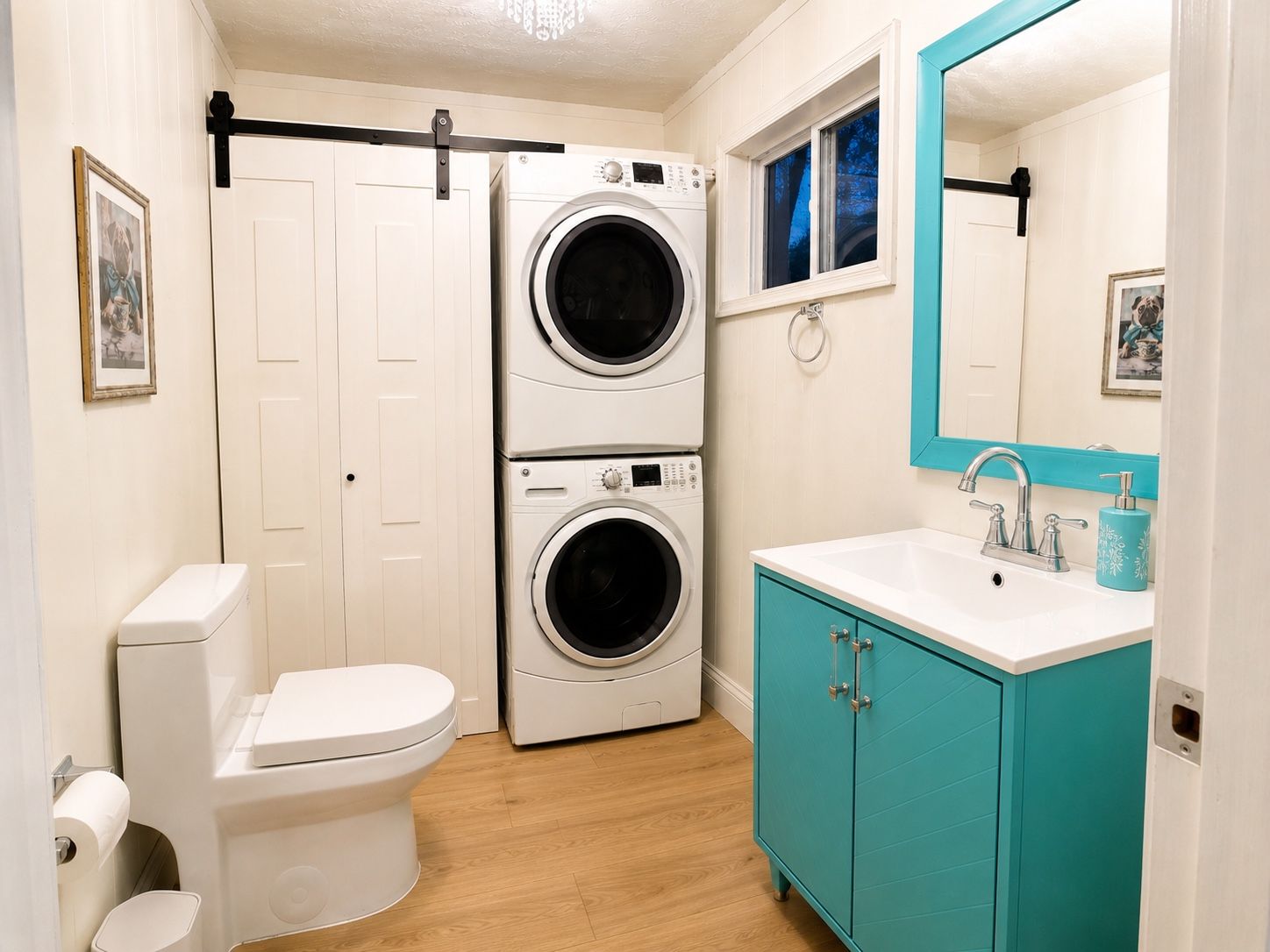 A compact bathroom with a toilet, a washing machine, and a sink with a mirror.