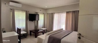 Cosmo Guest House : King Room with Garden View