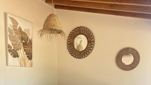 A hot tub with a bench, a wall-mounted mirror, and a hanging light fixture. - Les Albères Bed & Breakfast Suite with a view of the pool and terrace (Villelongue-dels-Monts)
