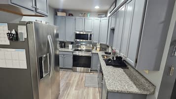 Coffee/tea maker, fridge, microwave, oven