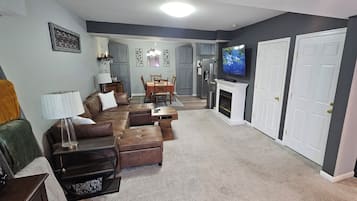 Smart TV, fireplace, books, music library