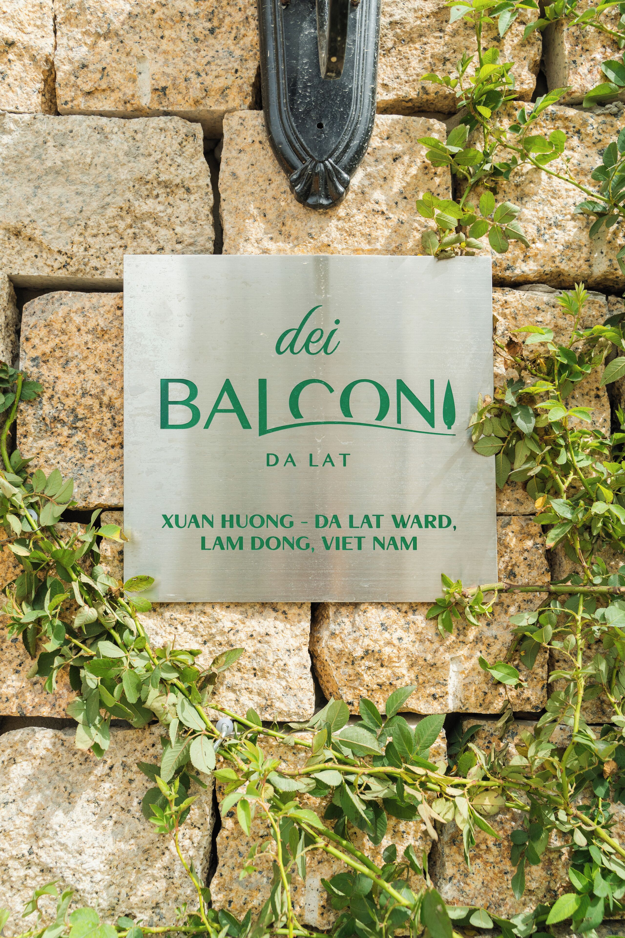 A sign with the text 'dei BALCONI DA LAT' and 'XUAN HUONG - DA LAT WARD, LAM DONG, VIET NAM'.