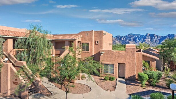 A modern building with a desert landscape and mountains in the background. - Delightful Resort Near Santa Catalina Mountains! (Oro Valley)