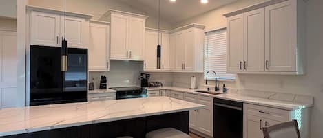 Coffee/tea maker, fridge, microwave, oven