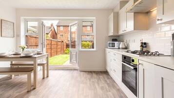 Coffee/tea maker, fridge, microwave, oven