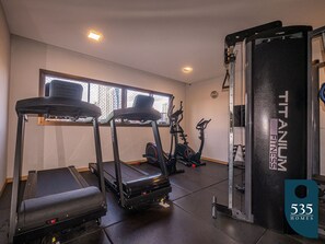 A gym with treadmills, a weight bench, and a squat rack. - Caminho das Árvores near the shopping malls (Salvador)