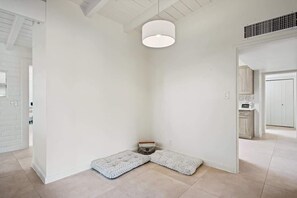 A corner of a room with a white floor, a white wall, and a white door. - Spacious Family Getaway-Pet Friendly! (Tucson)