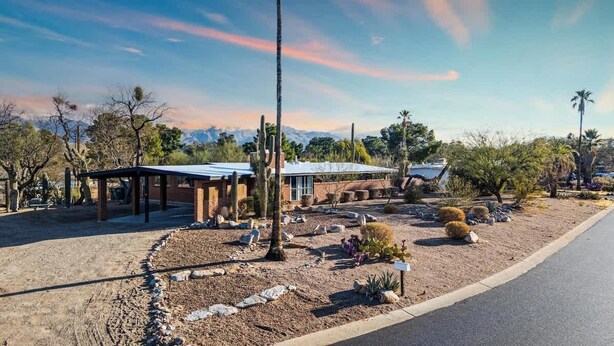 A desert landscape with a building featuring a covered patio and a mountain backdrop. - Mid-Century Desert Galore/Mt.Views/Pool (Tucson)