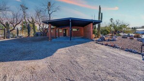 A building with a covered patio, surrounded by desert vegetation. - Mid-Century Desert Galore/Mt.Views/Pool (Tucson)