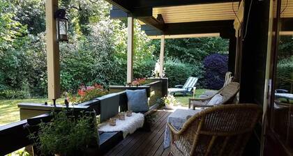 Charming Wooden House with a Porch on the Water!