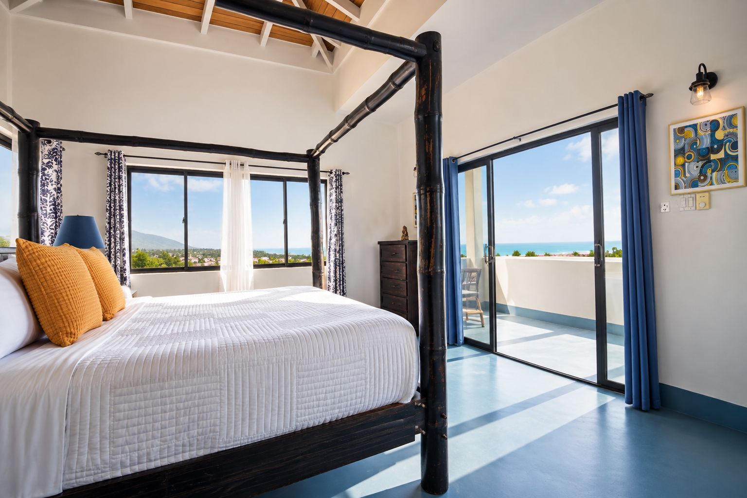 A four-poster bed with a view of the sea, a balcony with a chair, and a painting on the wall.