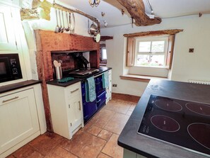A kitchen with a stove, oven, and microwave. - Claybottom Farm (Wigton)
