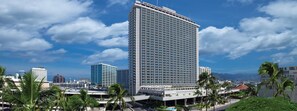 A high-rise hotel with a modern design, featuring a prominent glass facade and multiple balconies. - Newly Renovated Ala Moana with Balcony (Honolulu)
