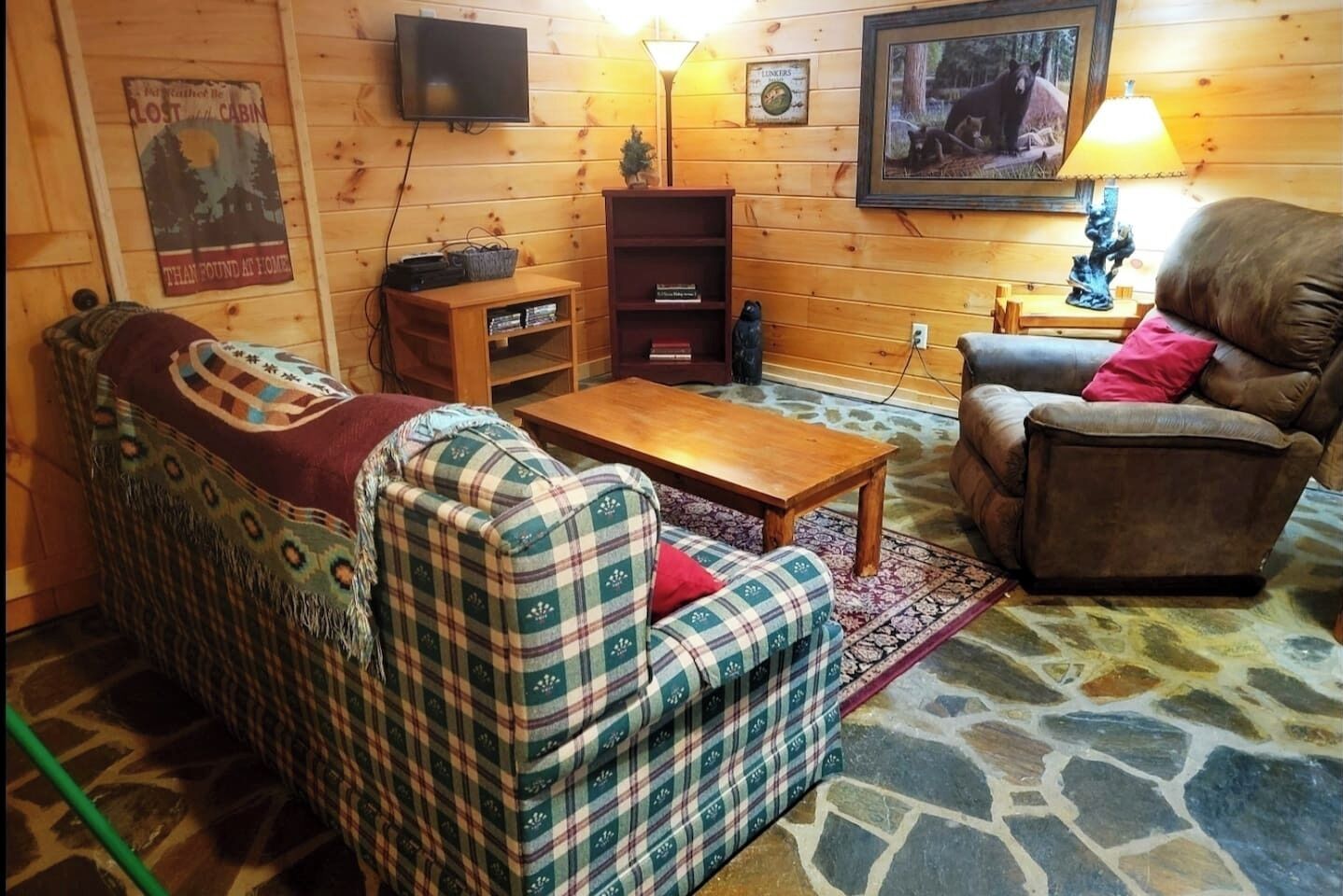 Lower level game room/ seating area with French Doors to lower level deck with log swing