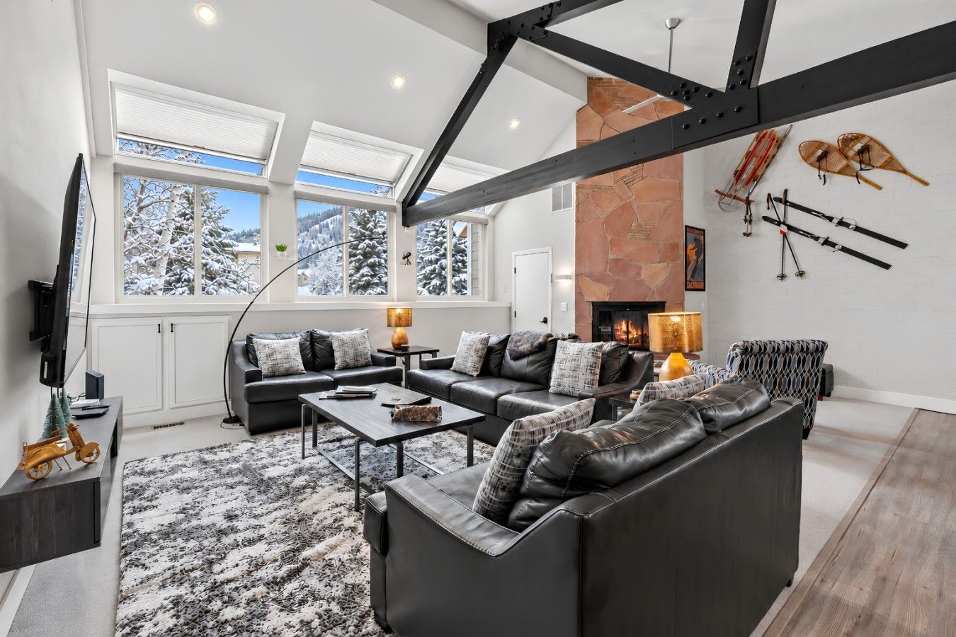 Spacious living room with vaulted ceilings and smart TV