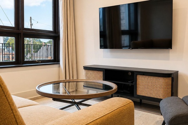 Deluxe Suite, 2 Bedrooms, Courtyard View | Living area | 55-inch Smart TV with digital channels