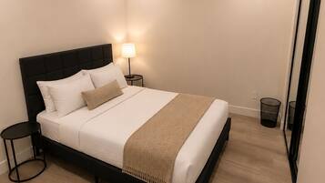 Deluxe Suite, 2 Bedrooms, Courtyard View | Premium bedding, memory foam beds, desk, blackout drapes