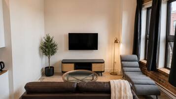 Deluxe Suite, 1 Queen Bed, Non Smoking, Kitchen | Living area | 55-inch Smart TV with digital channels