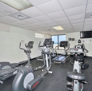 A gym with treadmills, elliptical machines, and a stationary bike. - SLEEPS 8! Beautiful & Inviting 1-BR + 1.5-BA Condo On The Beach  (Hollywood)