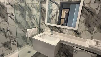Superior Single Room, Balcony | Bathroom | Shower, hair dryer, towels, soap