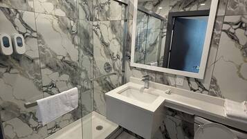 Superior Single Room, 1 King Bed, Balcony | Bathroom | Shower, hair dryer, towels, soap