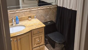 A bathroom with a sink, mirror, and shower curtain. - Bellerive Country Club 3.2 mi to BMW Tourney Golf with Outdoor Bar Chesterfield (Chesterfield)