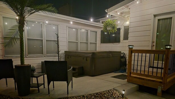An outdoor patio area with a seating arrangement, a hot tub, and a wooden deck. - Bellerive Country Club 3.2 mi to BMW Tourney Golf with Outdoor Bar Chesterfield (Chesterfield)