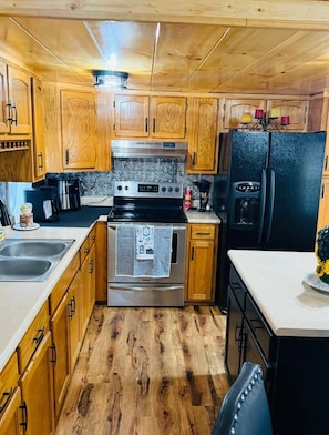 Coffee/tea maker, fridge, microwave, oven