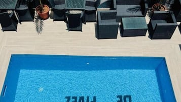 Outdoor pool, pool umbrellas, sun loungers