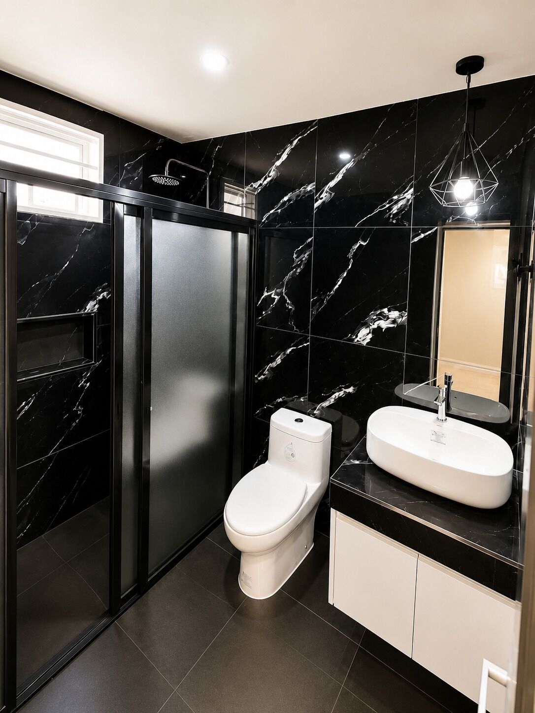 A modern bathroom with a toilet, sink, and mirror.