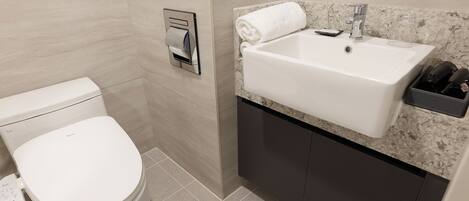 A modern bathroom with a toilet, a sink, and a towel rack.