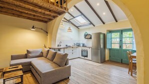 A modern kitchen with white cabinets, a stainless steel refrigerator, and a skylight. - Palmela Oasis Apartment II, By Home Match (Palmela)