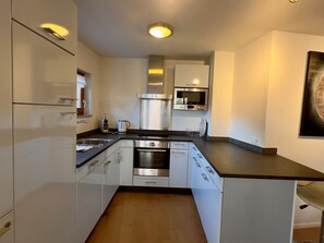Fridge, microwave, cookware/dishes/utensils - Walensee House & Apartments, (Unterterzen), by Interhome (Unterterzen)