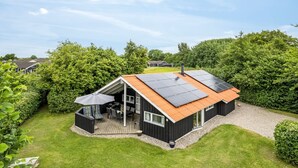A modern house with a deck, solar panels, and a garden. - "Ljubinko" - 300m from the sea by Interhome (Sydals)