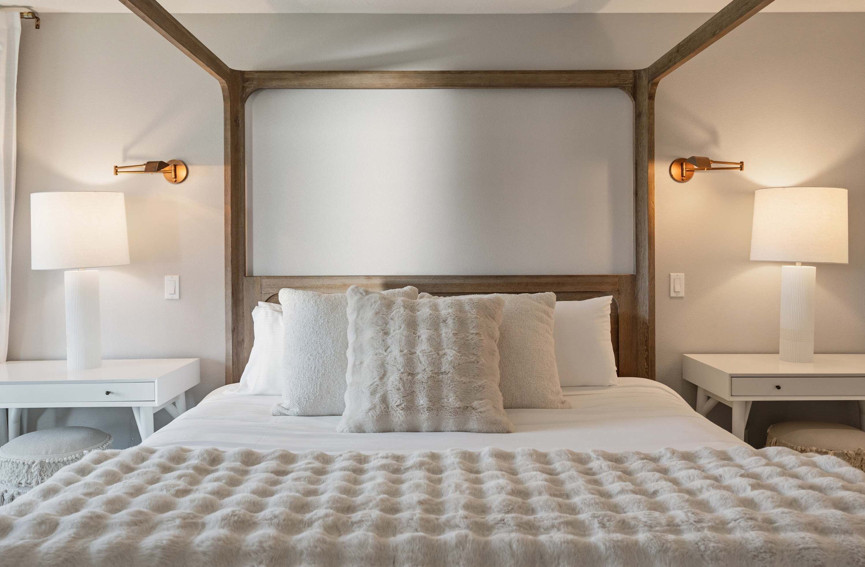 Primary bedroom with a four-poster canopy bed