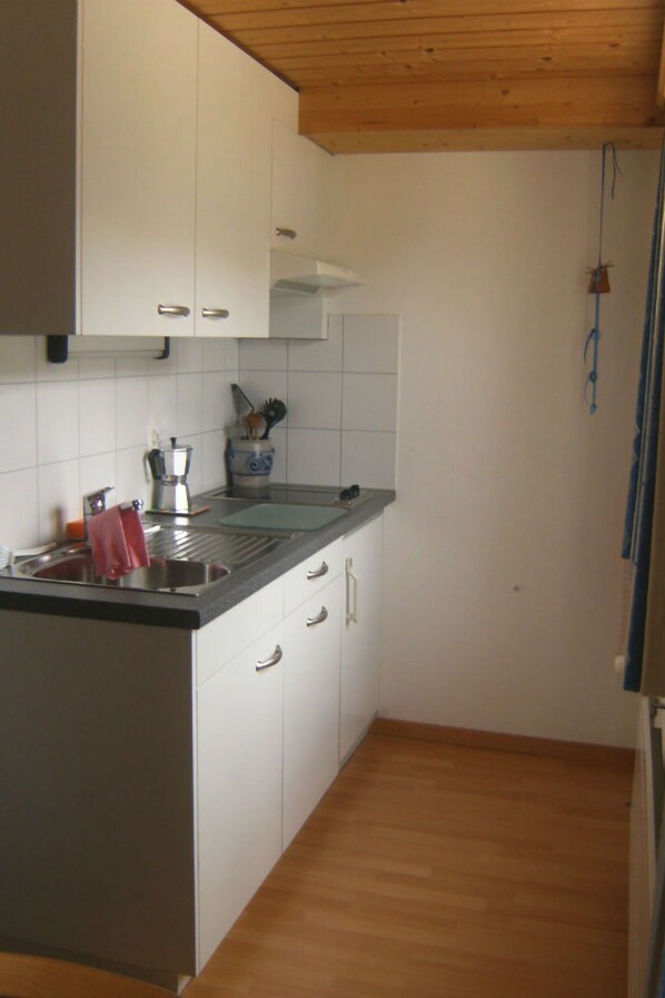 Fridge, microwave, cookware/dishes/utensils
