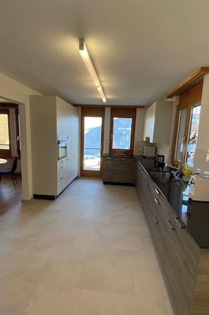 Fridge, oven, dishwasher, cookware/dishes/utensils - Ferienwohnungen JHS, (Seewis), by Interhome (Seewis im Prättigau)