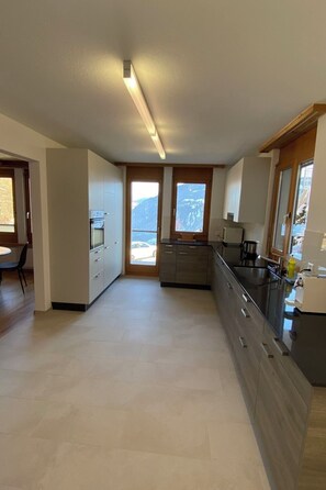 Fridge, oven, dishwasher, cookware/dishes/utensils - Ferienwohnungen JHS, (Seewis), by Interhome (Seewis im Prättigau)