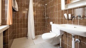A bathroom with a shower, toilet, and sink. - Casa Viva, (Bad Ragaz), by Interhome (Bad Ragaz)
