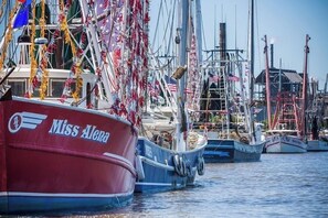 A marina with boats docked, including one named 'Miss Alena.' - Short Walk to Beach | Pet-Friendly Duplex | Deck & Grill (Fernandina Beach)