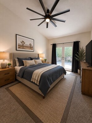 A bedroom with a bed, bedside tables, a ceiling fan, a window with curtains, and a television. - Modern Palm Springs Oasis - Heated Pool, Spa & Mountain View’s - Permit # 053440 (Palm Springs)