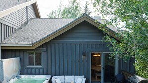 A house with a hot tub, a covered deck, and a barbecue grill. - 5BR Park City retreat with hot tub, fireplace, mountain views. (Park City)