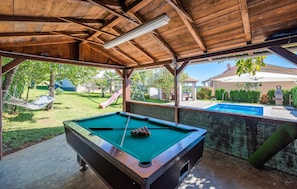 An outdoor pool area with a pool table and a hammock. - Awesome home in Pazin (Pazin)