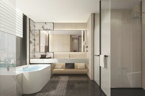 A modern bathroom with a freestanding bathtub, a large mirror, and a walk-in shower.