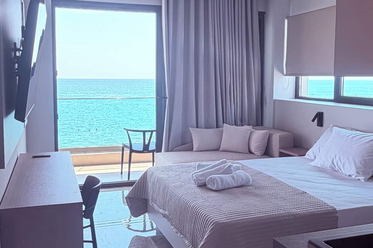 Deluxe Triple Room, Balcony, Sea View | In-room safe, WiFi (free), bed sheets