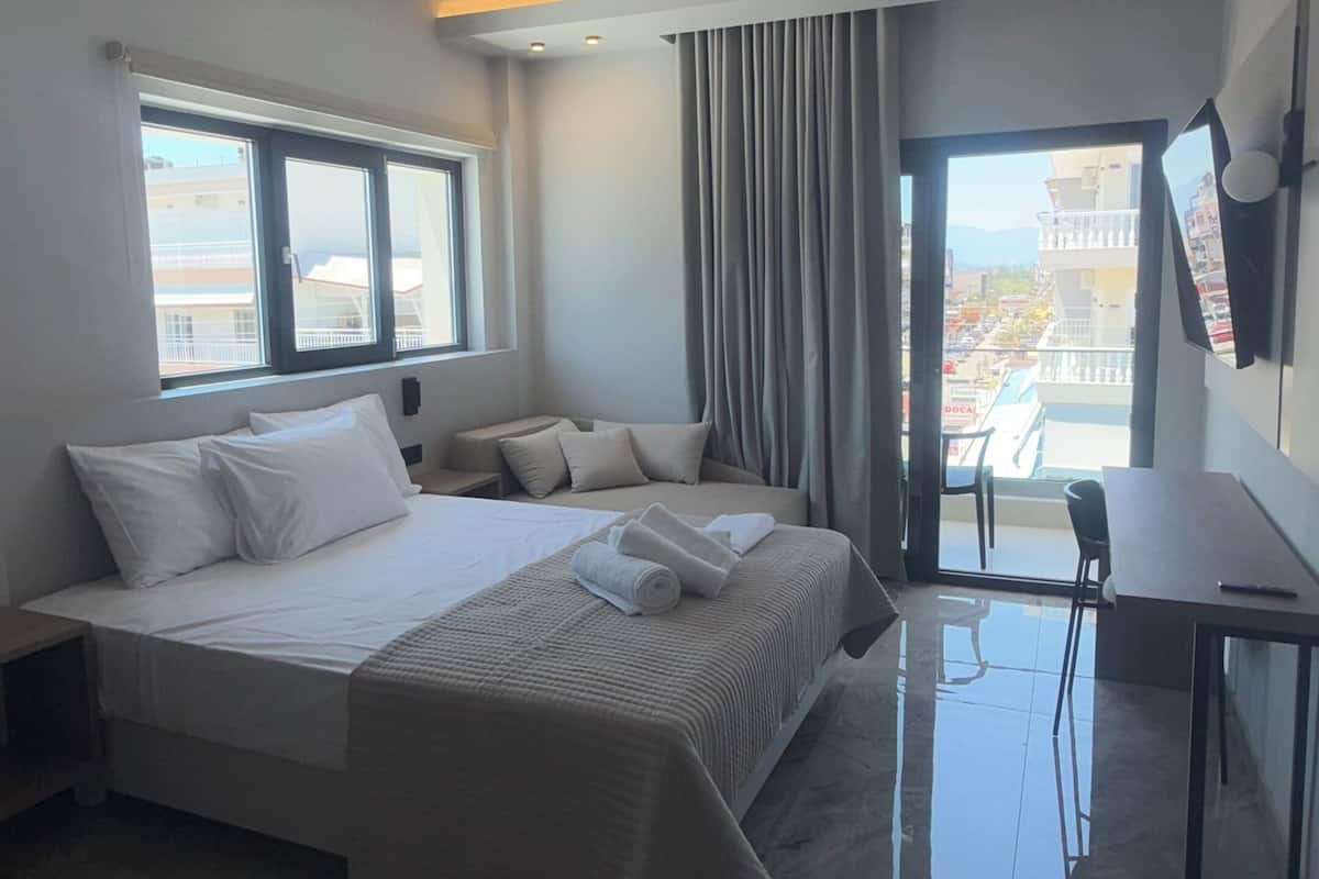 Deluxe Triple Room, Balcony, City View | In-room safe, WiFi (free), bed sheets